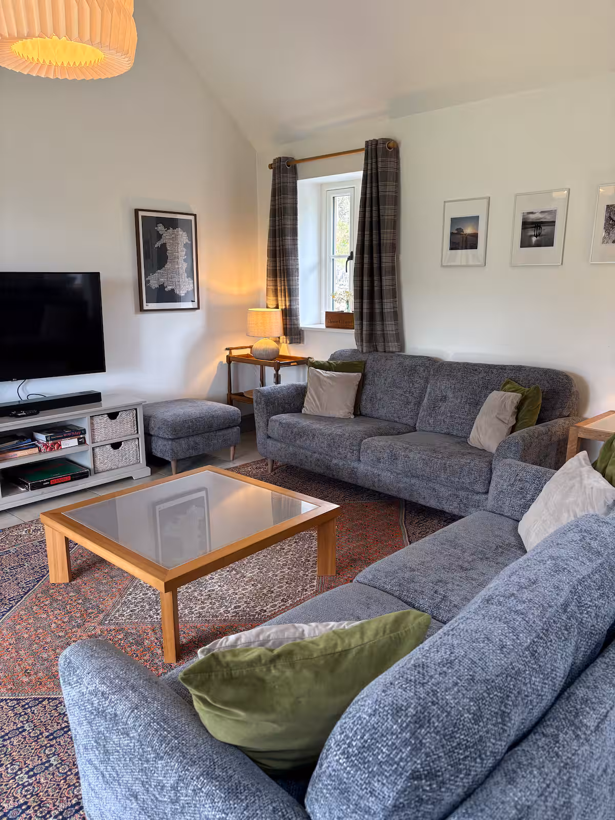 The Barn double-height living area with log burner