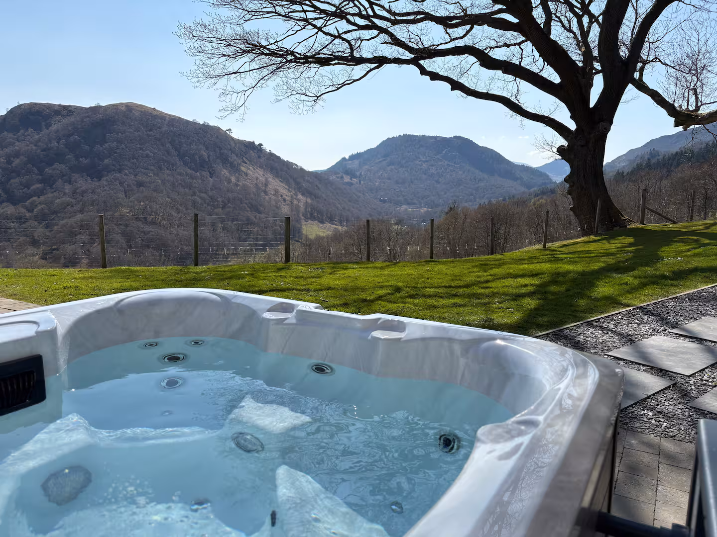 The Barn's hot tub on the patio, looking across the Conwy Valley
